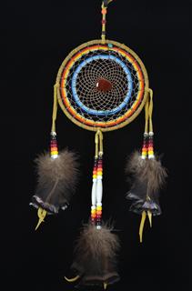Beaded dream catcher by Navajo artist Kenneth Begay with a carnelian  stone bear in center