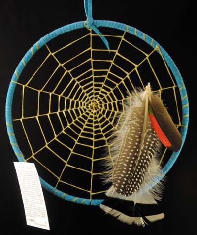 A light blue Ojibway style weave dream catcher by Tom Rael